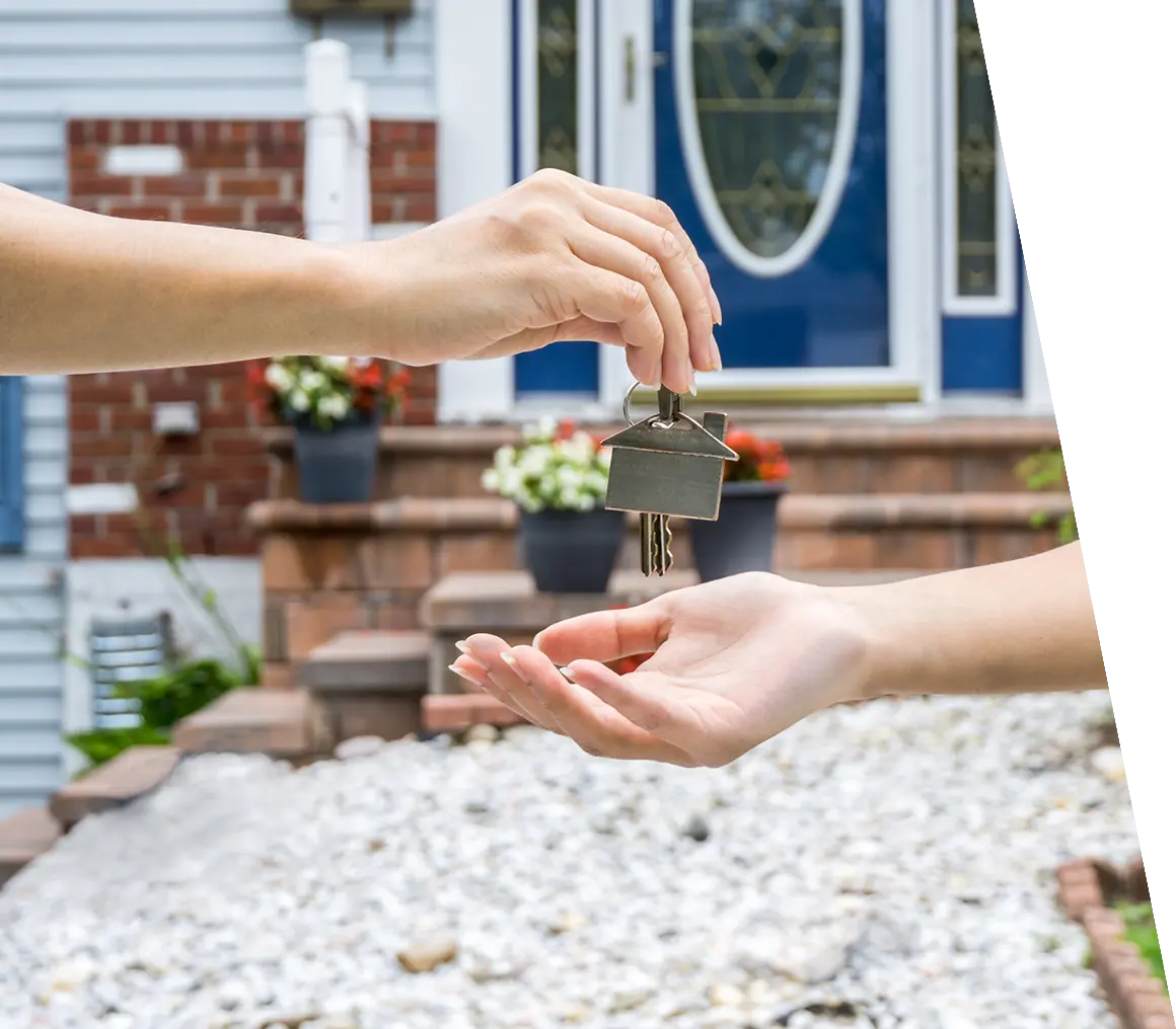 Handing house keys to another person.