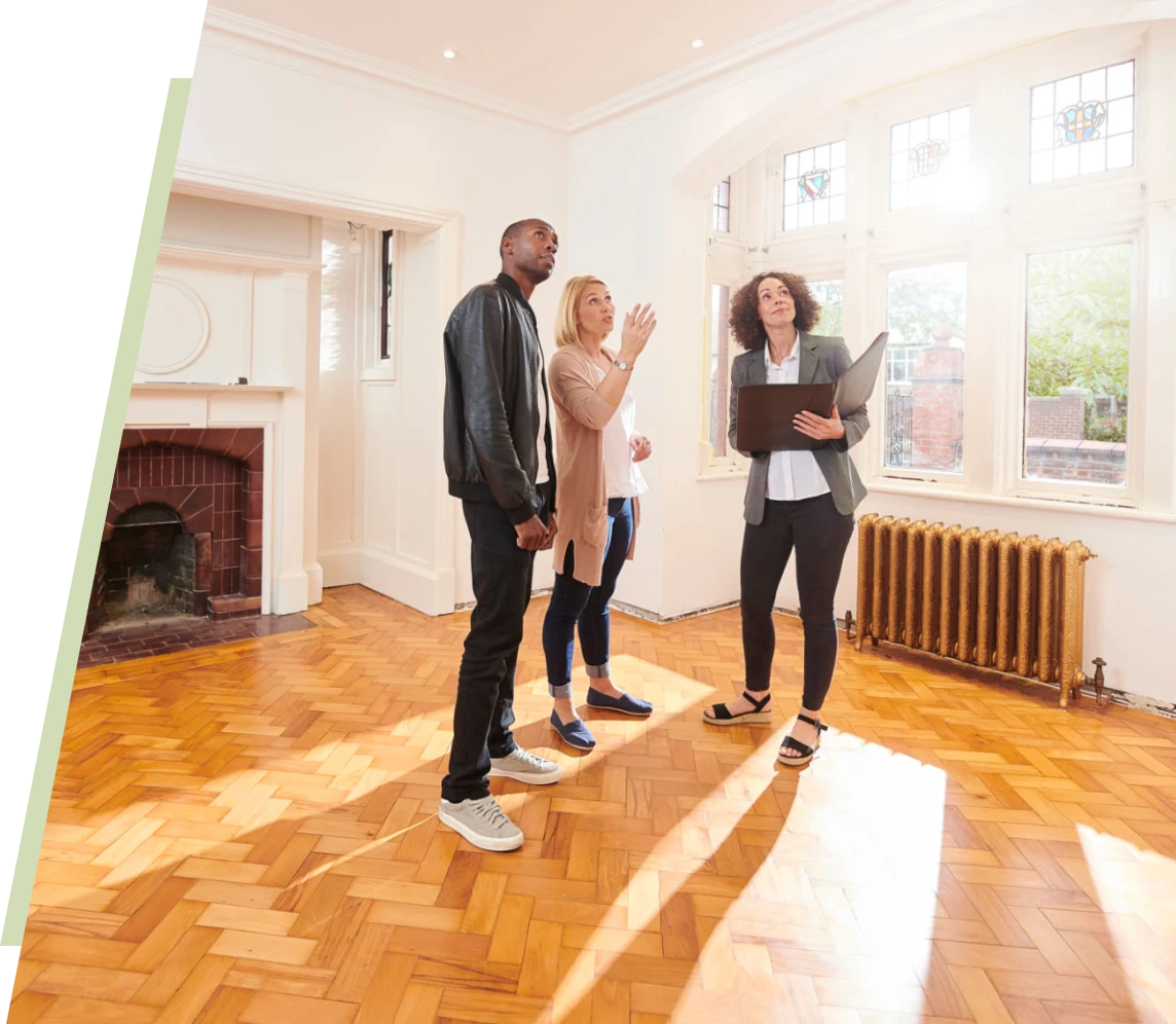 Realtor showing house to prospective buyers.