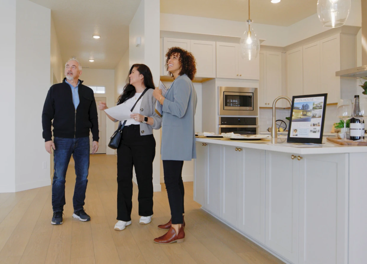 People viewing a modern kitchen interior design.