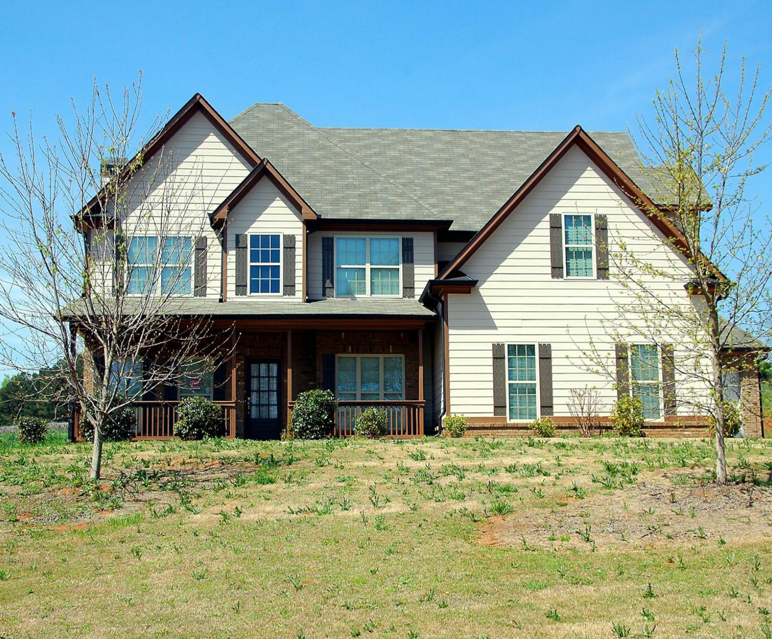 Large suburban house with front porch.